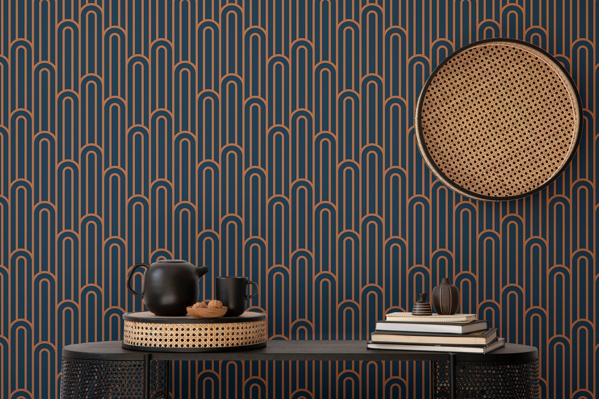 Dark navy wallpaper with orange lines behind a black console table.