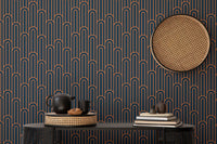 Dark navy wallpaper with orange lines behind a black console table.