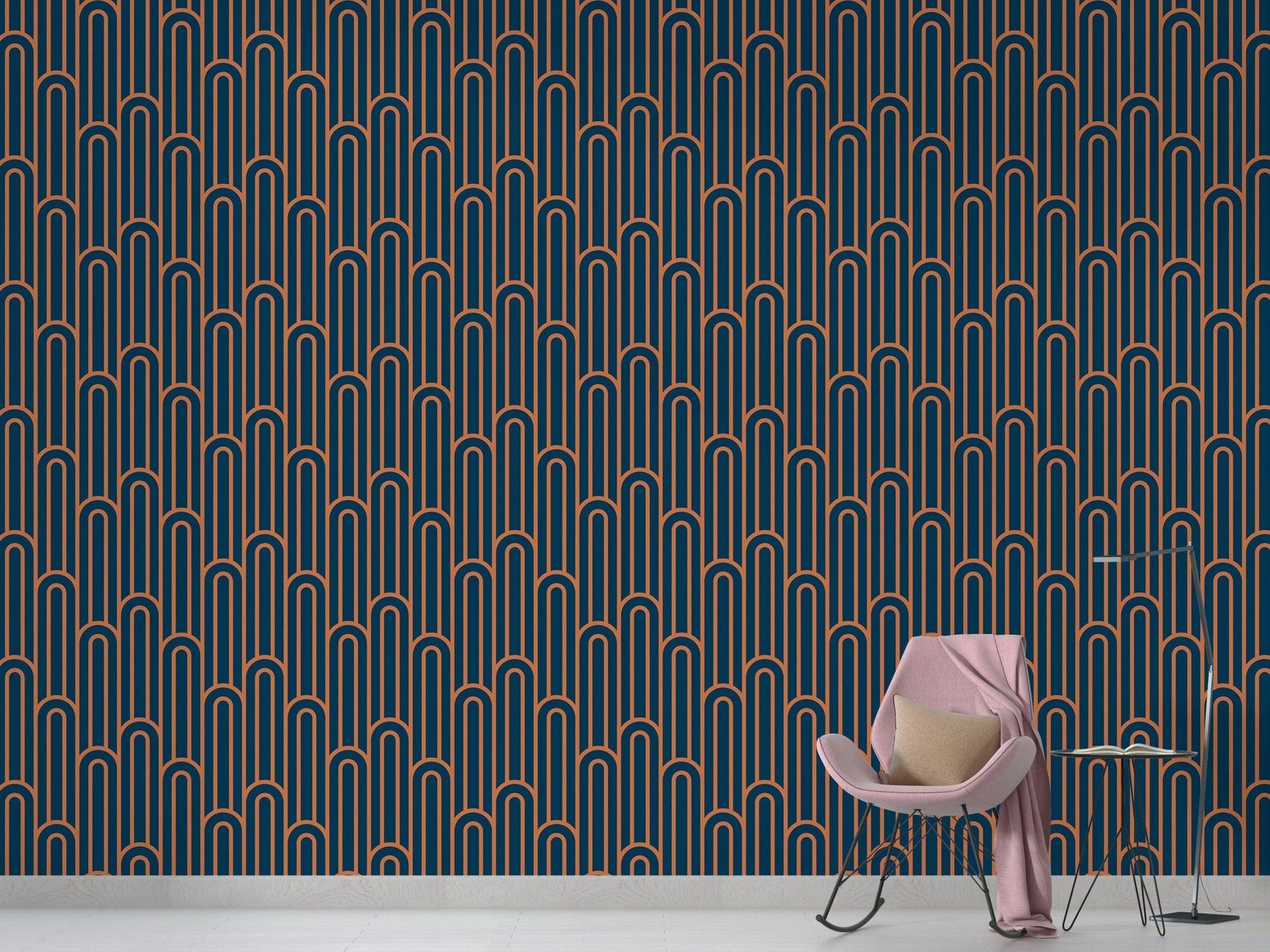 Navy blue and orange linear wallpaper in a minimalist room with a pink chair.