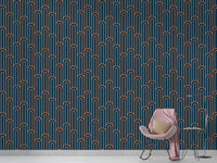 Navy blue and orange linear wallpaper in a minimalist room with a pink chair.