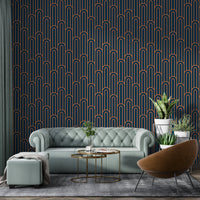 Symmetrical arch wallpaper in a living room with a green velvet sofa.
