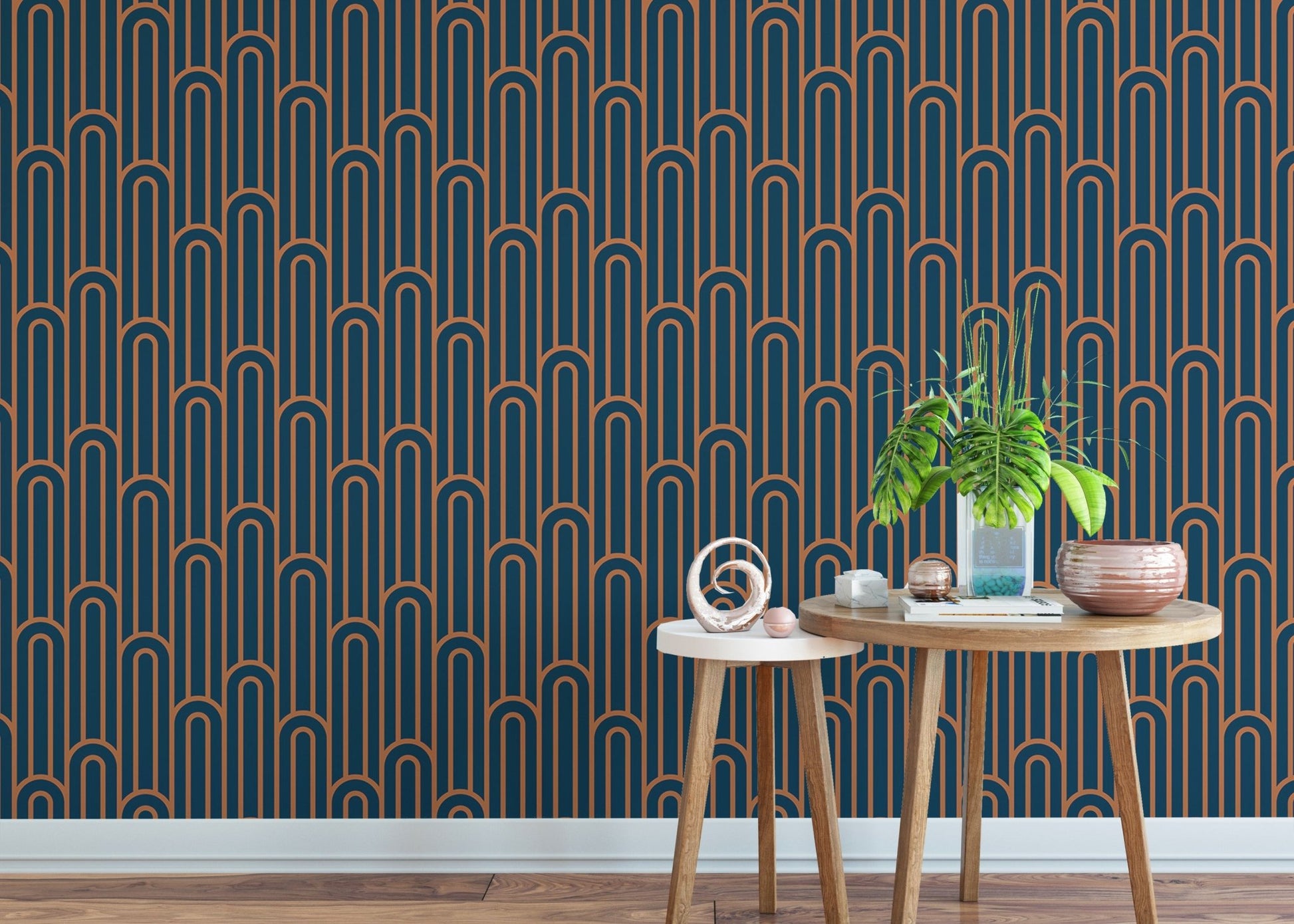 Abstract Art Deco Arches Orange Color Wallpaper behind small wooden tables.