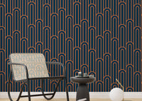 Dark navy and orange arch pattern wallpaper in a sitting with black furniture.