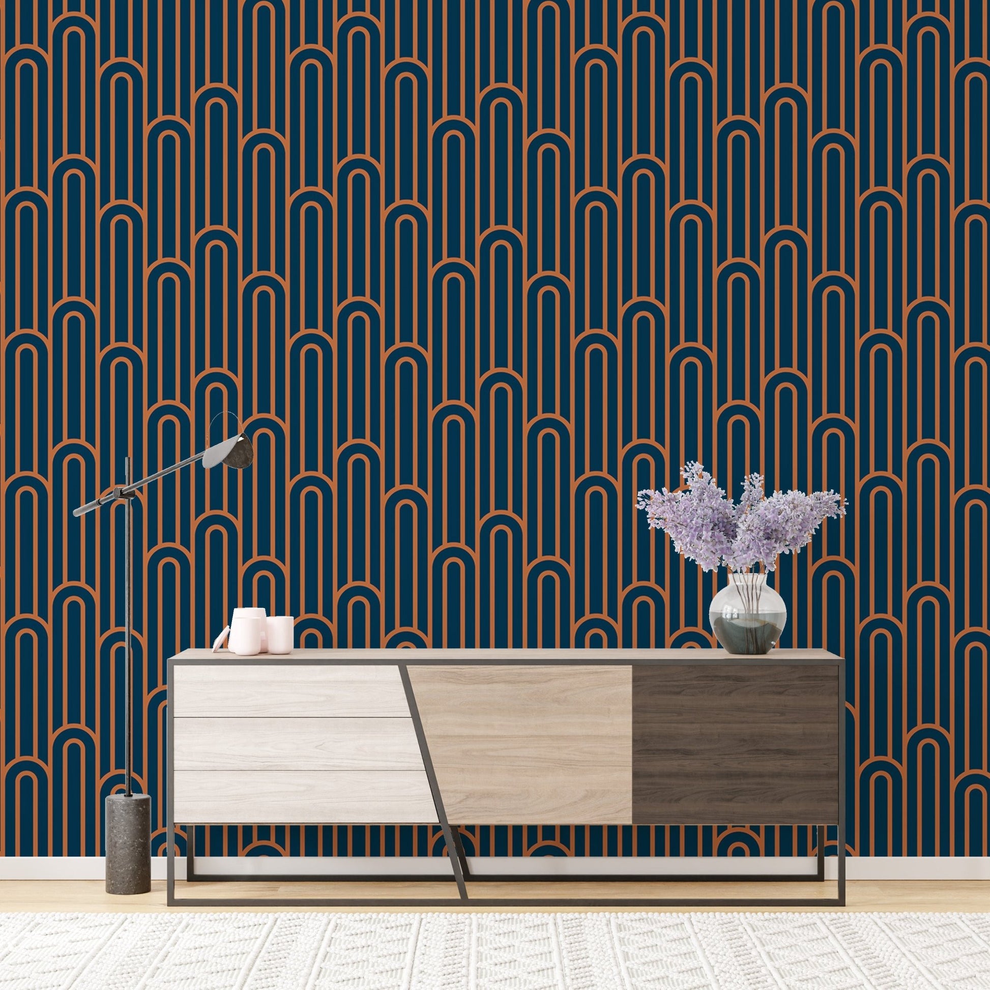 Geometric Art Deco wallpaper behind a modern wooden cabinet unit.