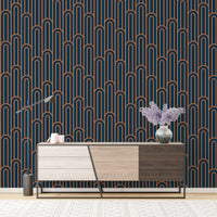 Geometric Art Deco wallpaper behind a modern wooden cabinet unit.