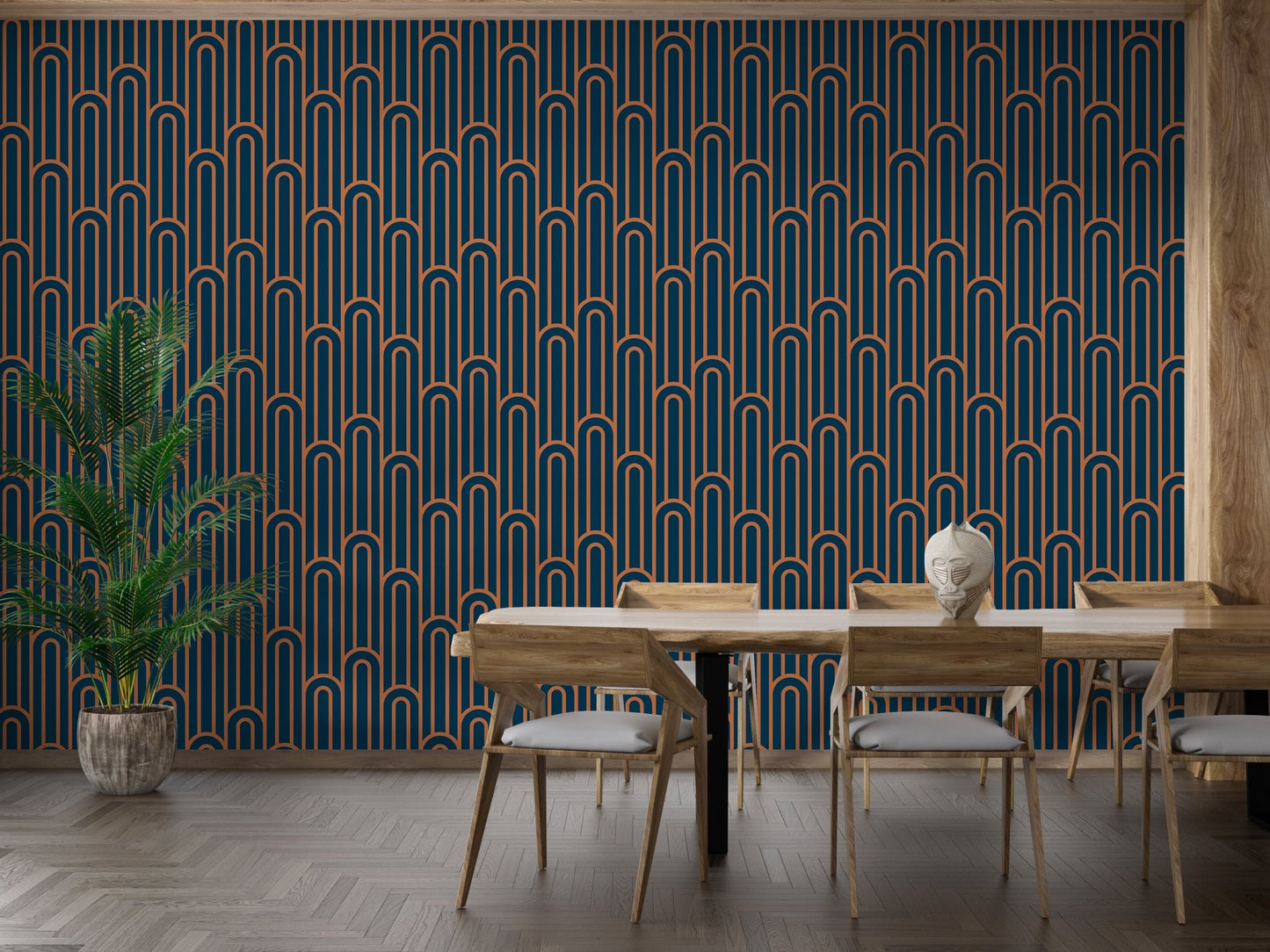 Large scale Art Deco wallpaper in a dining area with a wooden table.