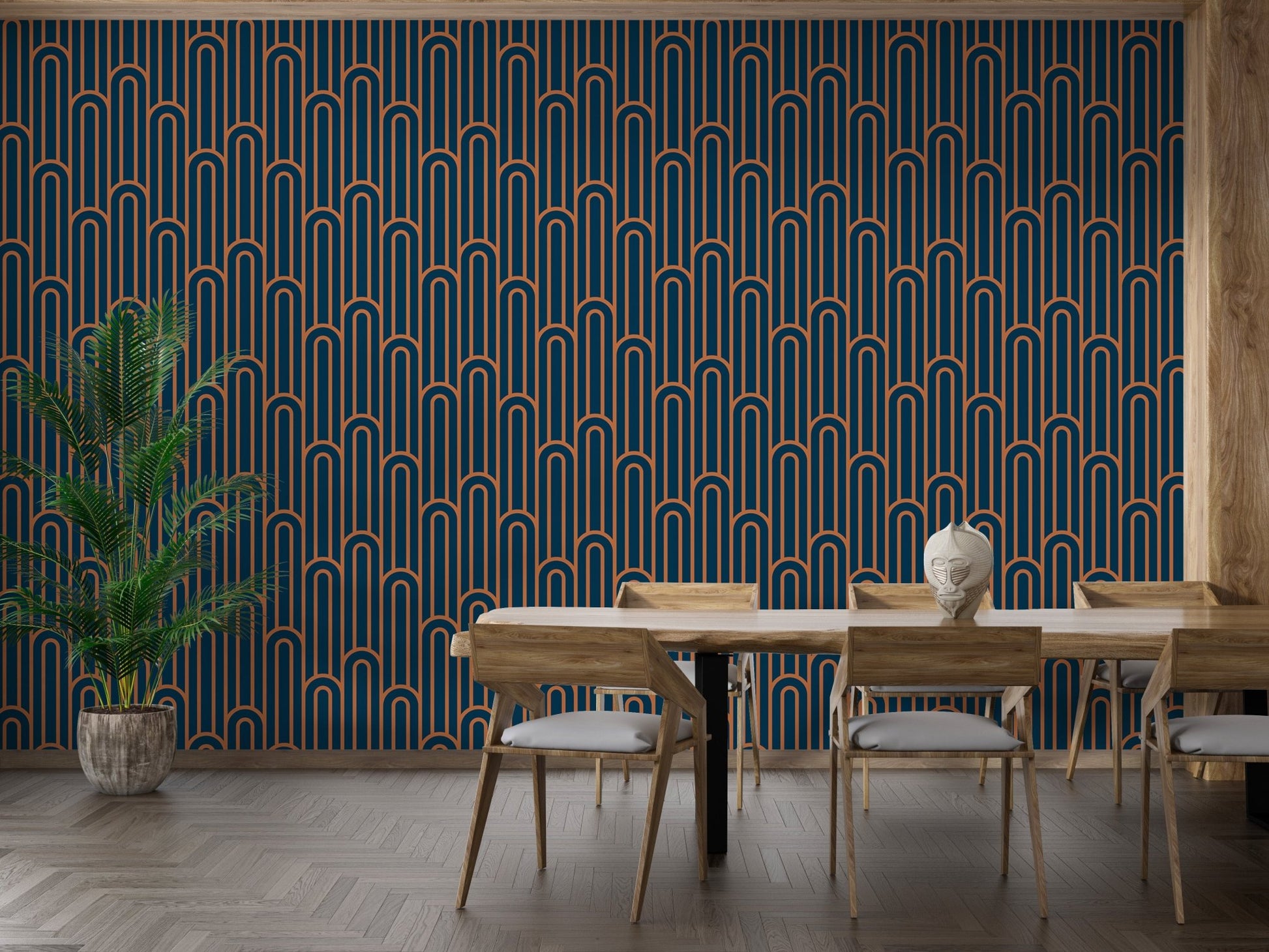 Large scale Art Deco wallpaper in a dining area with a wooden table.
