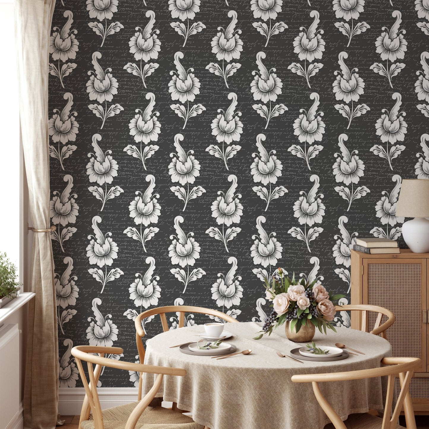 Damask pattern wallpaper in a dining space with a round wooden table.