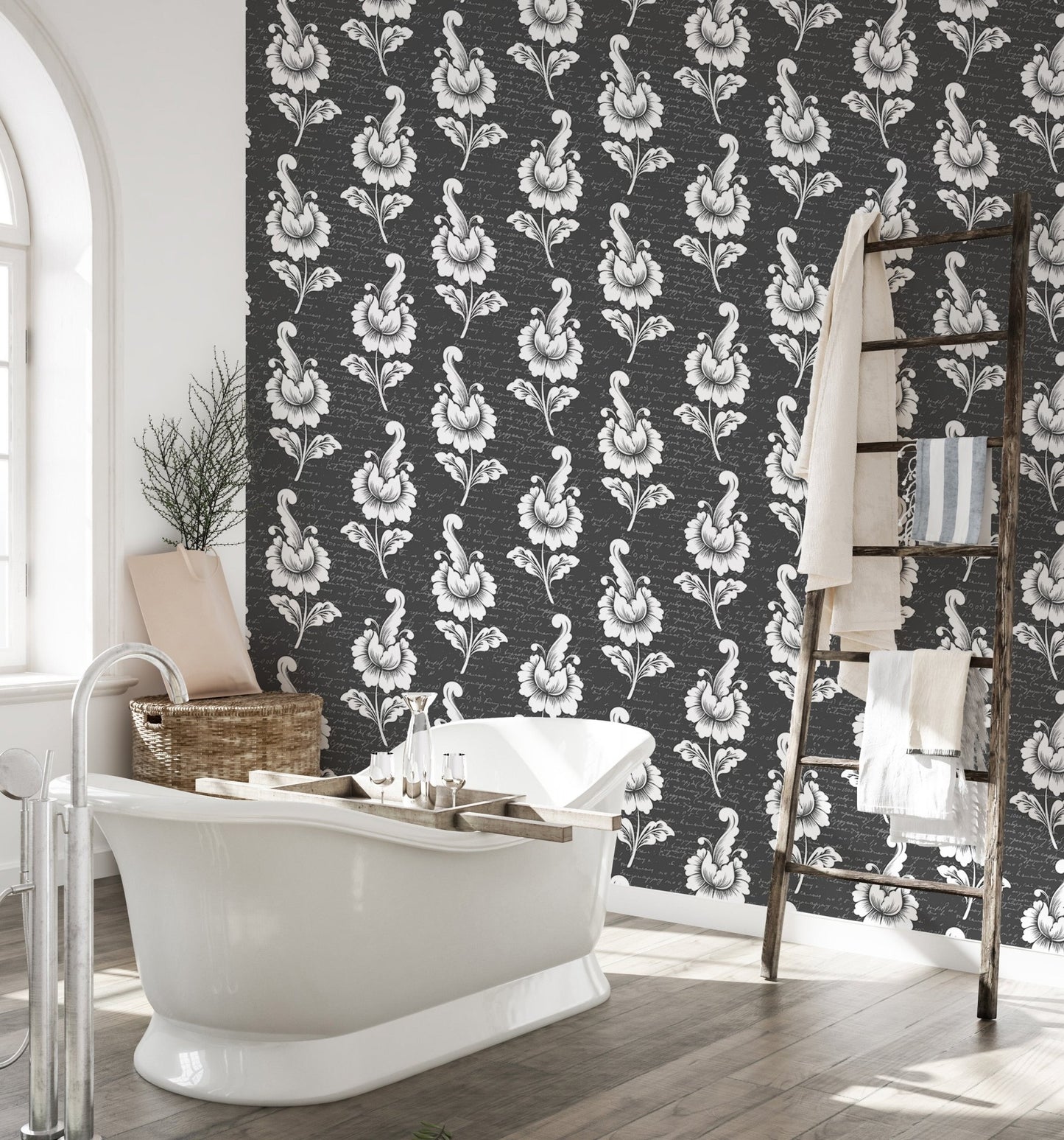 Black damask wallpaper in a bathroom with a white freestanding tub.