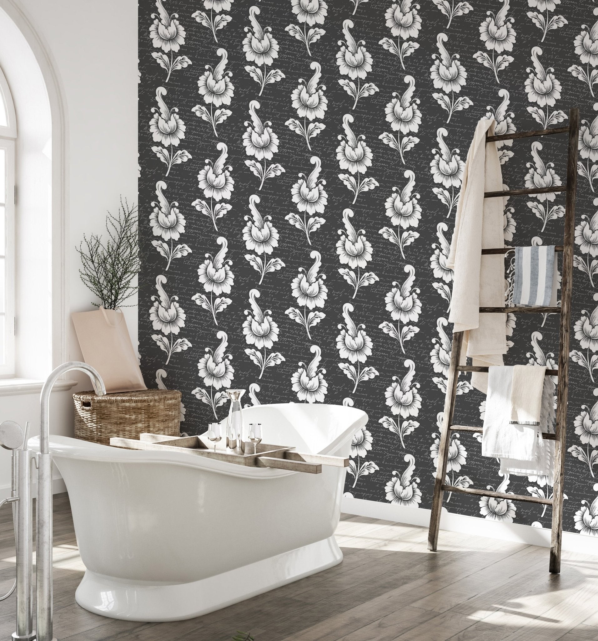 Black damask wallpaper in a bathroom with a white freestanding tub.