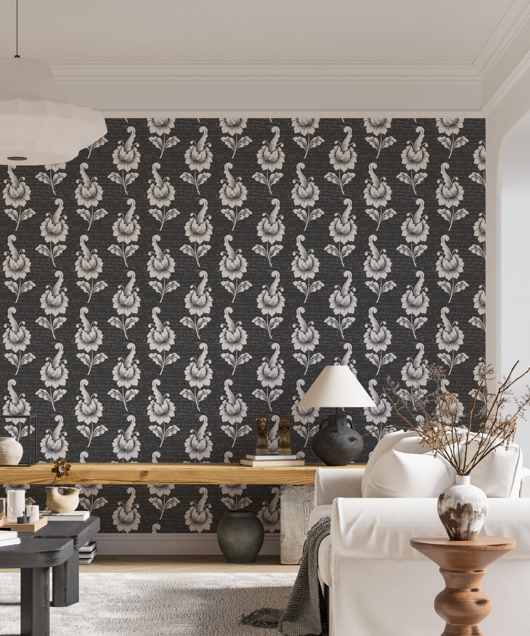 Vertical leaf pattern wallpaper in a living area with a wooden desk.