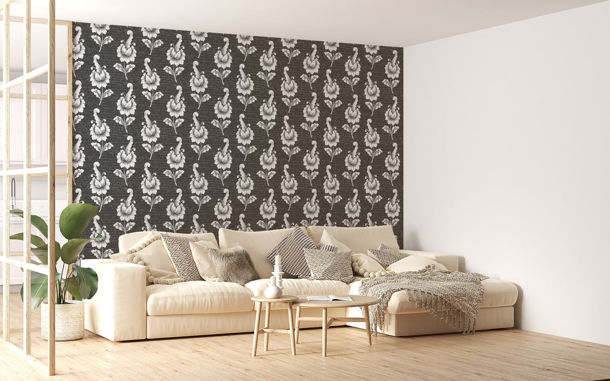 Abstract autumn leaf design black damask wallpaper behind a large cream sofa.