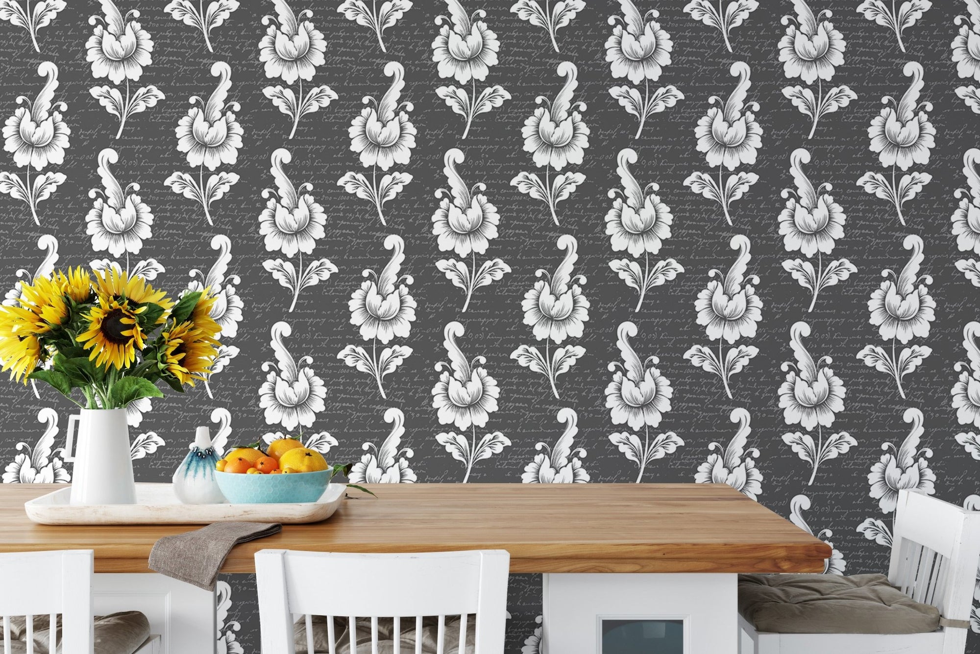 Abstract autumn leaf design black damask wallpaper behind wooden dining table.