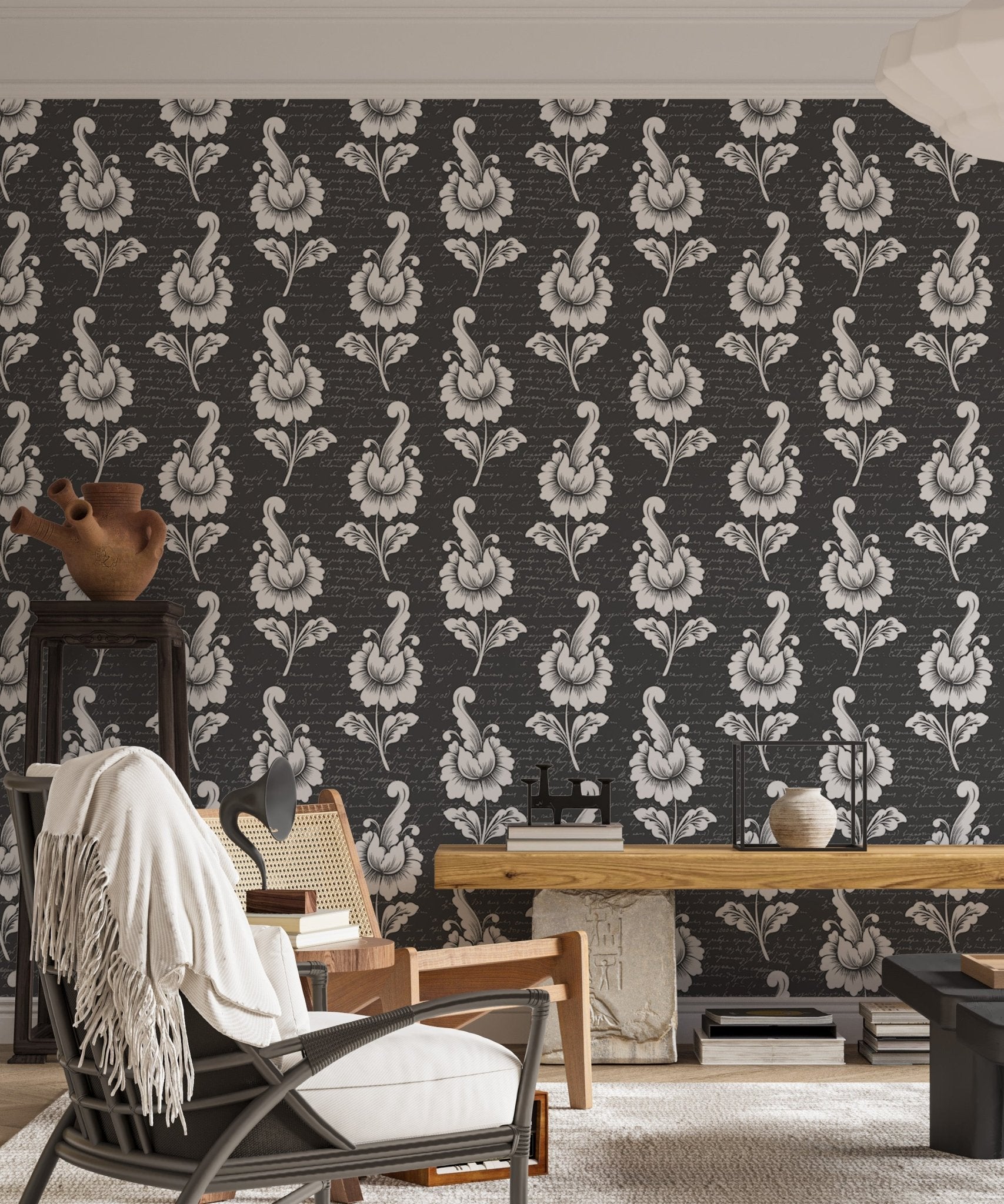 Black and white leaf wallpaper in a living area with a recliner chair.