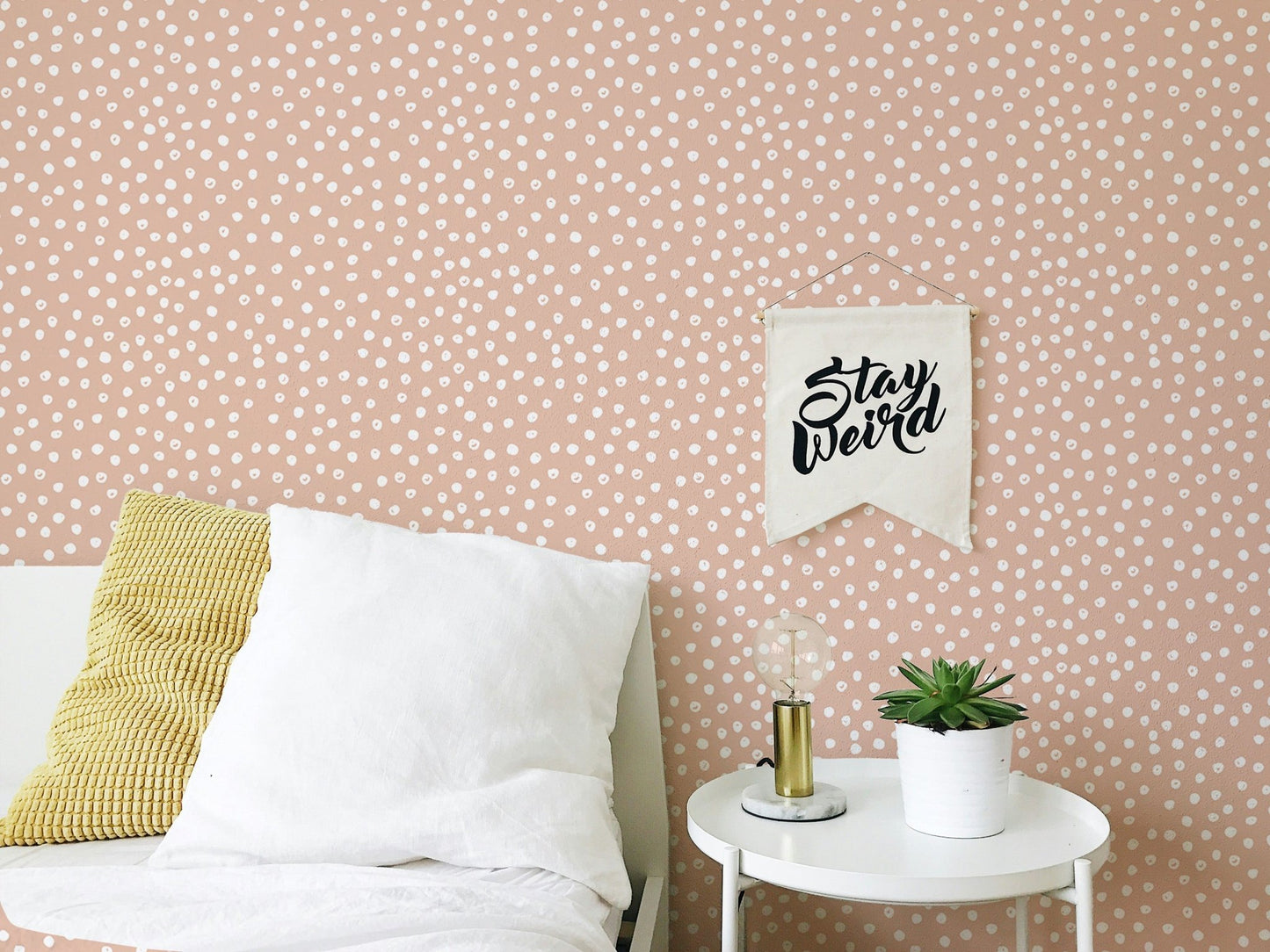 Artistic beige brush dots on white wallpaper for bedroom walls.
