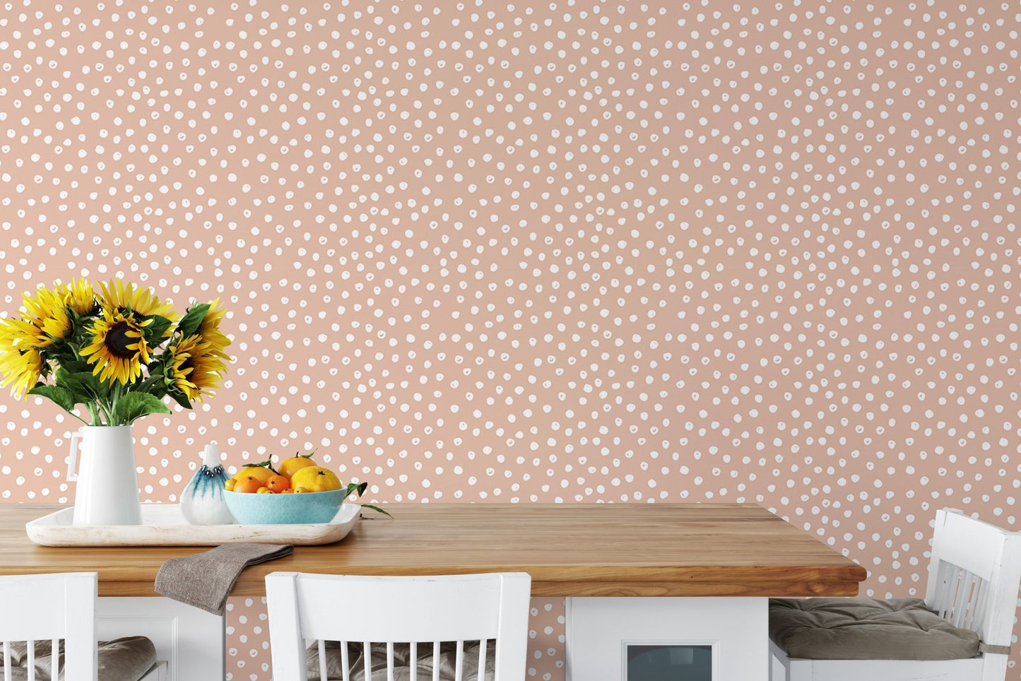 Kitchen dining table with sunflowers and white dot wallpaper.