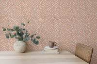Neutral abstract polka dots wallpaper with brush effect in dining area.
