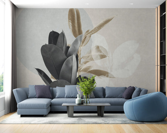Large blue sectional sofa in a bright room with grey leaves design wall mural.