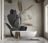 Modern bathroom with a freestanding tub and large leaves silhouette wall mural.