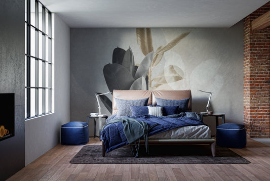 Modern bedroom with blue bedding and abstract black and beige leaves wall mural