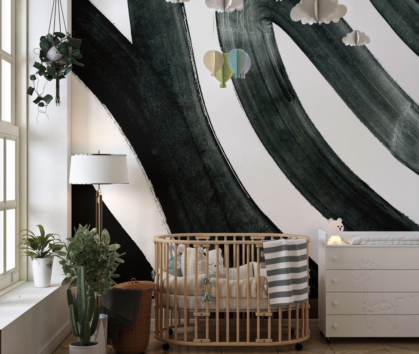 Black ink fusion mural with dynamic abstract patterns in kids room.
