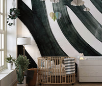 Black ink fusion mural with dynamic abstract patterns in kids room.
