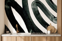 Black ink wall mural showcasing an artistic abstract theme in kitchen backdrop.

