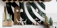 Artistic black ink wall mural for a contemporary aesthetic in cafe area
