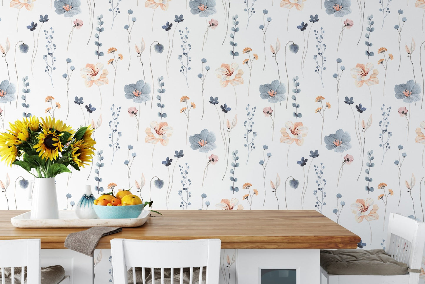 Blue and orange flower wallpaper in a dining room with a wooden table.