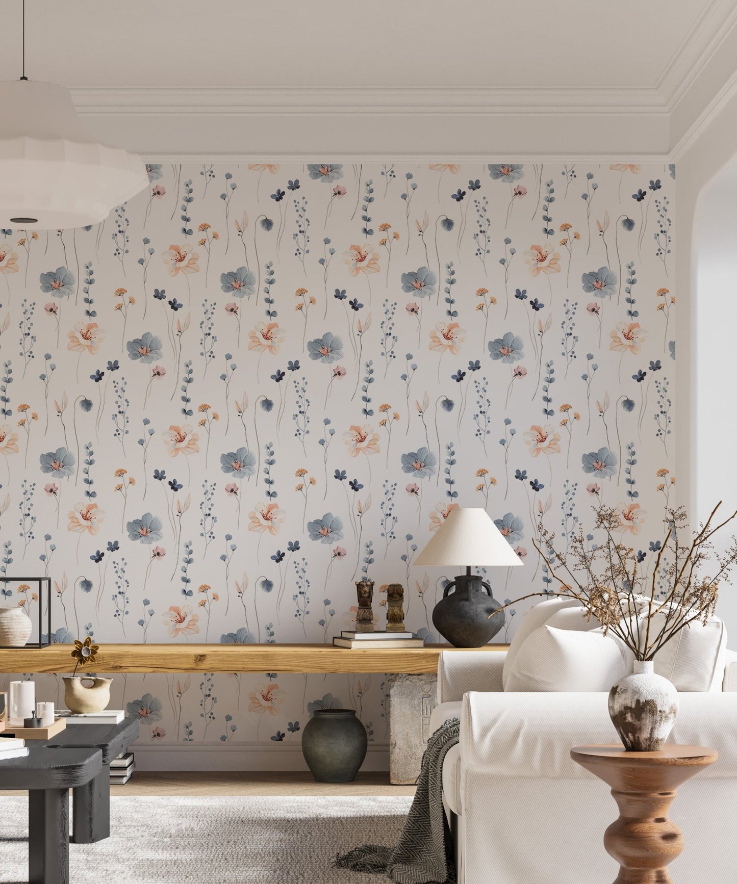 Blue and beige botanical wallpaper in a bright home with a wooden desk.
