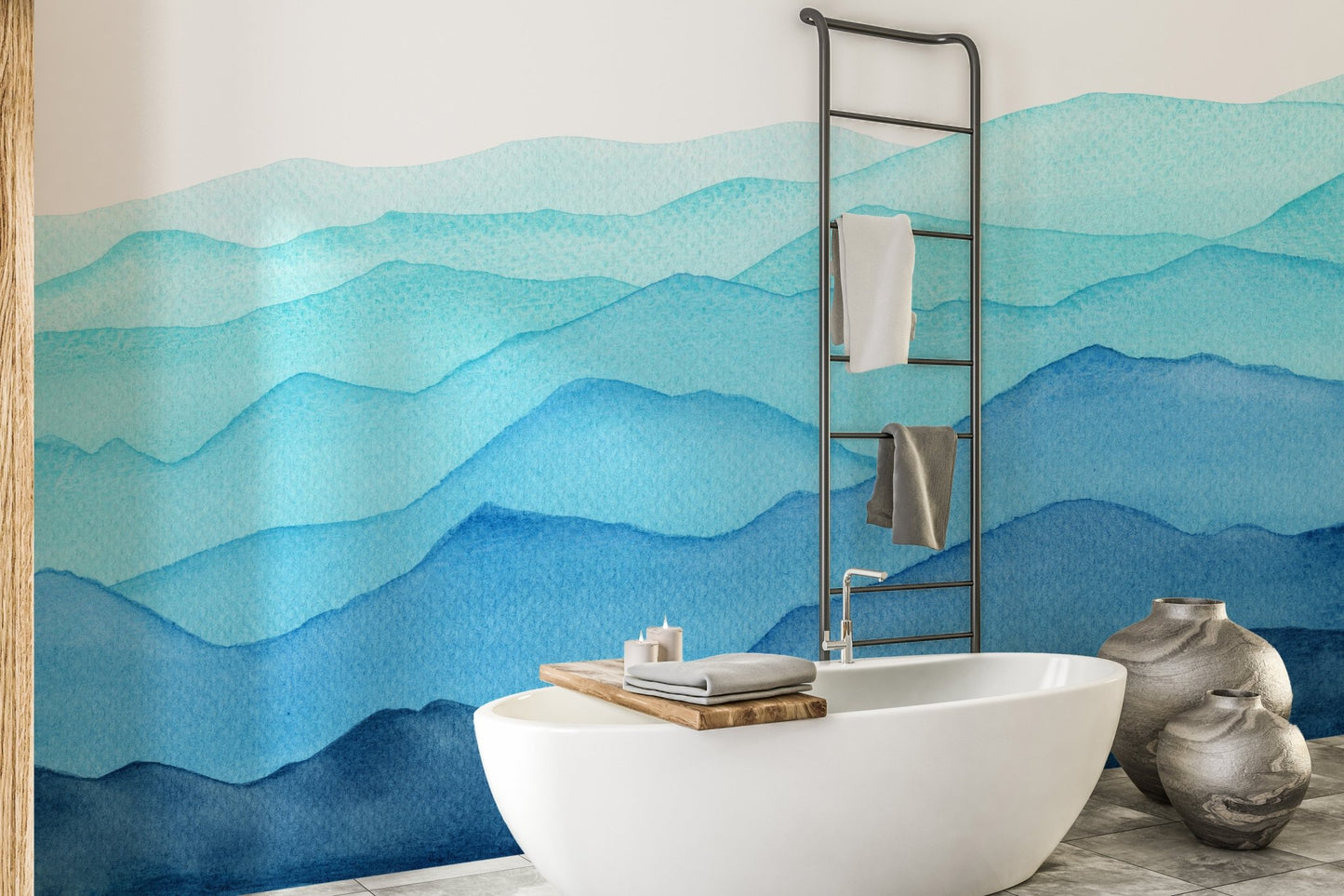 Abstract blue mountain wall mural behind a freestanding bathtub