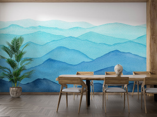 Blue watercolor mountain layers wall mural in a wooden dining room