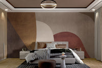 Large scale geometric wall mural with tan and brown overlapping curves.