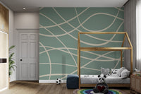 Flowing cream colored paths on a flat green surface textured wall mural.