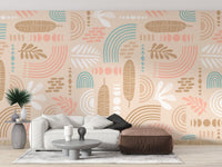 Abstract leaves and geometric shapes beige color wall mural in a modern living room.