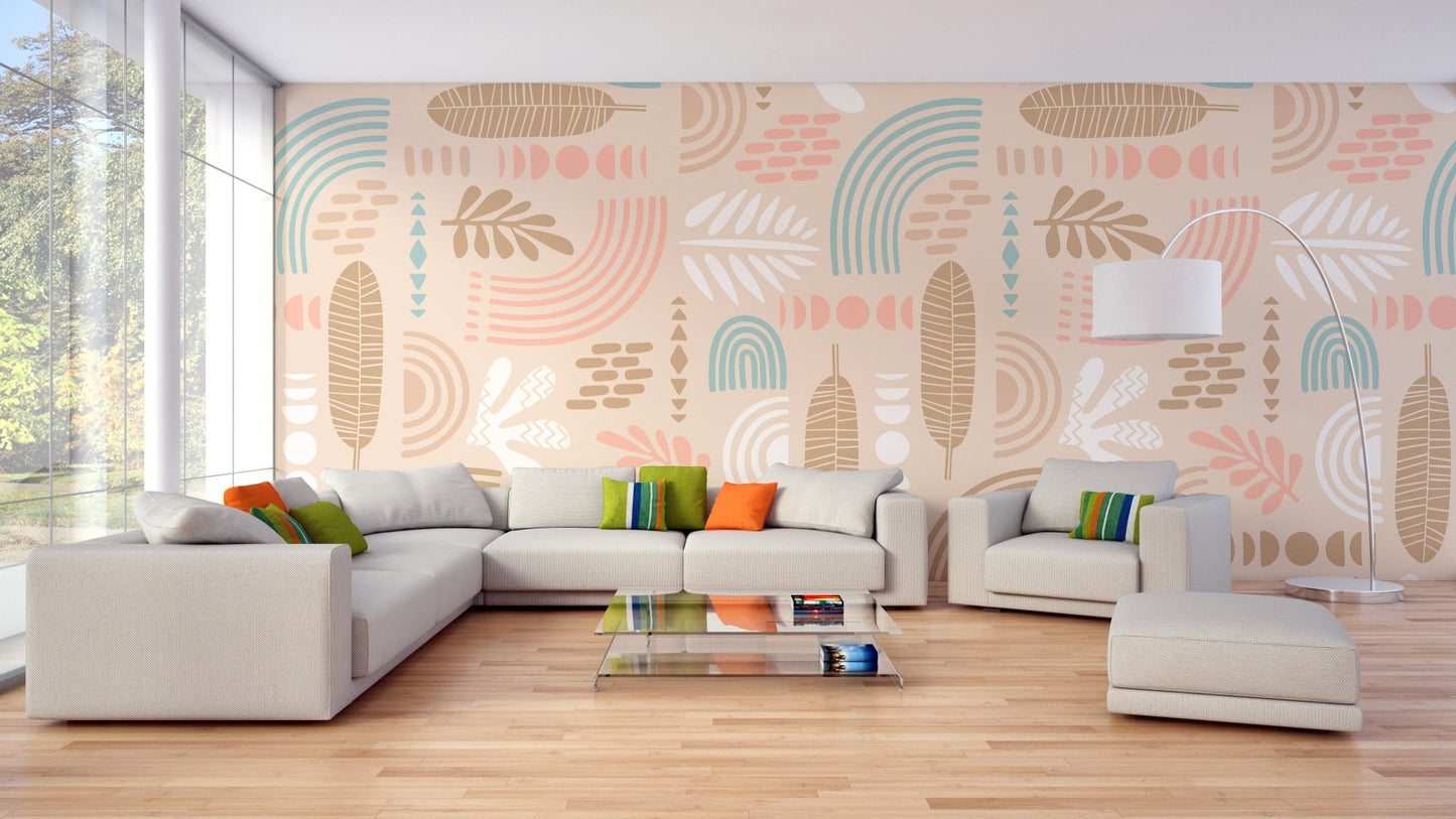 Abstract leaves and geometric shapes beige color wall mural behind a dark grey couch.