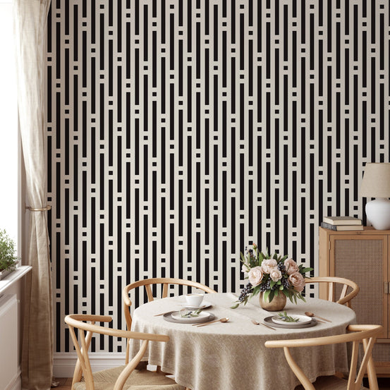 Abstract Lines Geometric Wallpaper in a dining room with a round table and tan chairs.