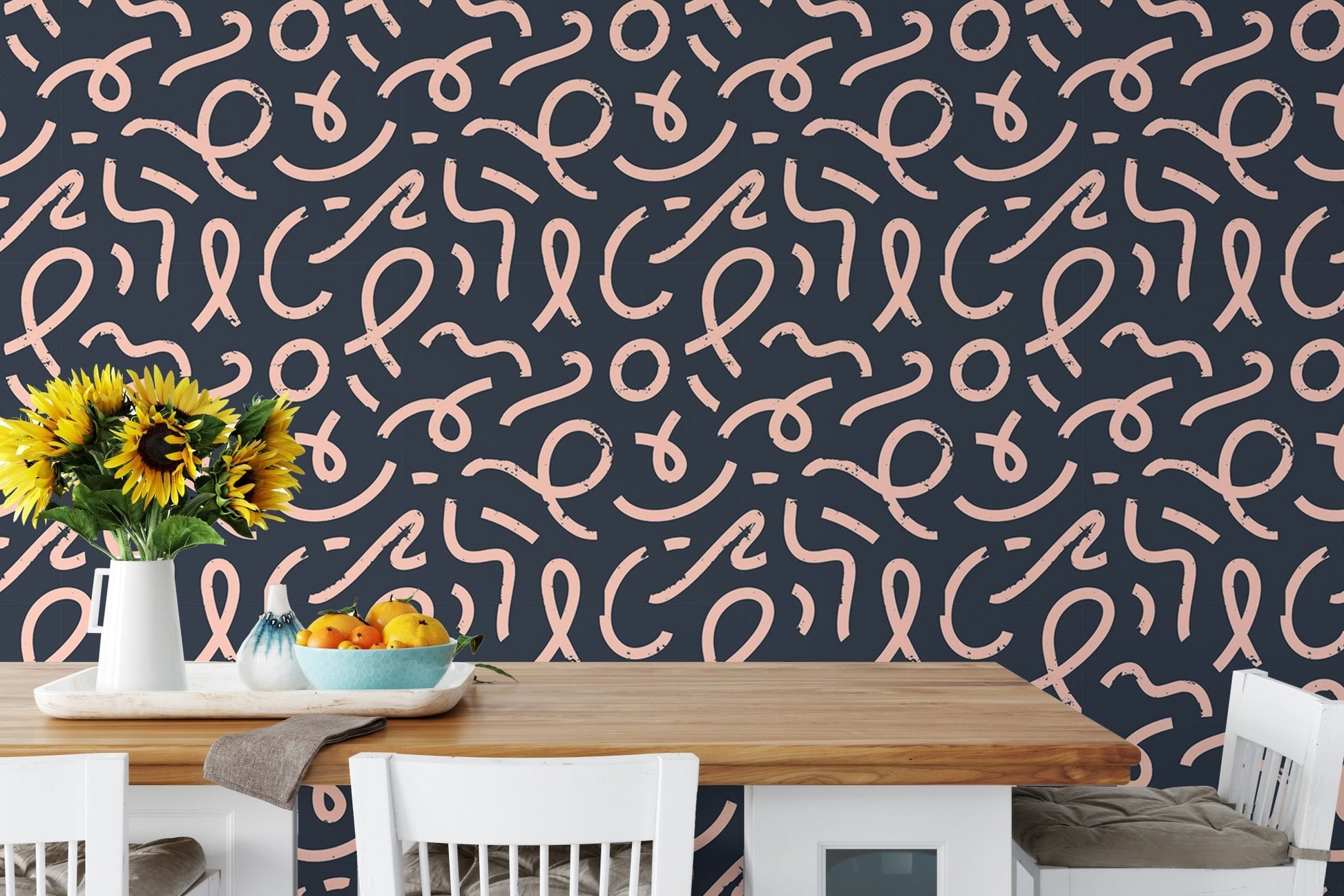 Abstract minimal line brush stroke wallpaper behind a wooden dining set.