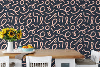Abstract minimal line brush stroke wallpaper behind a wooden dining set.