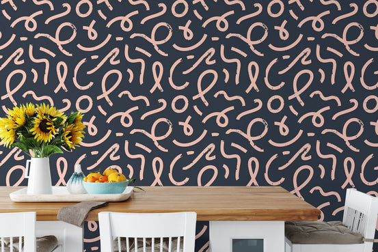 Abstract minimal line brush stroke wallpaper behind a wooden dining set.