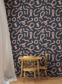 Dark blue wallpaper with squiggly pink lines in a small dining area.