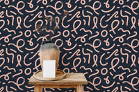 Minimalist line wallpaper with abstract patterns on a wooden console table.