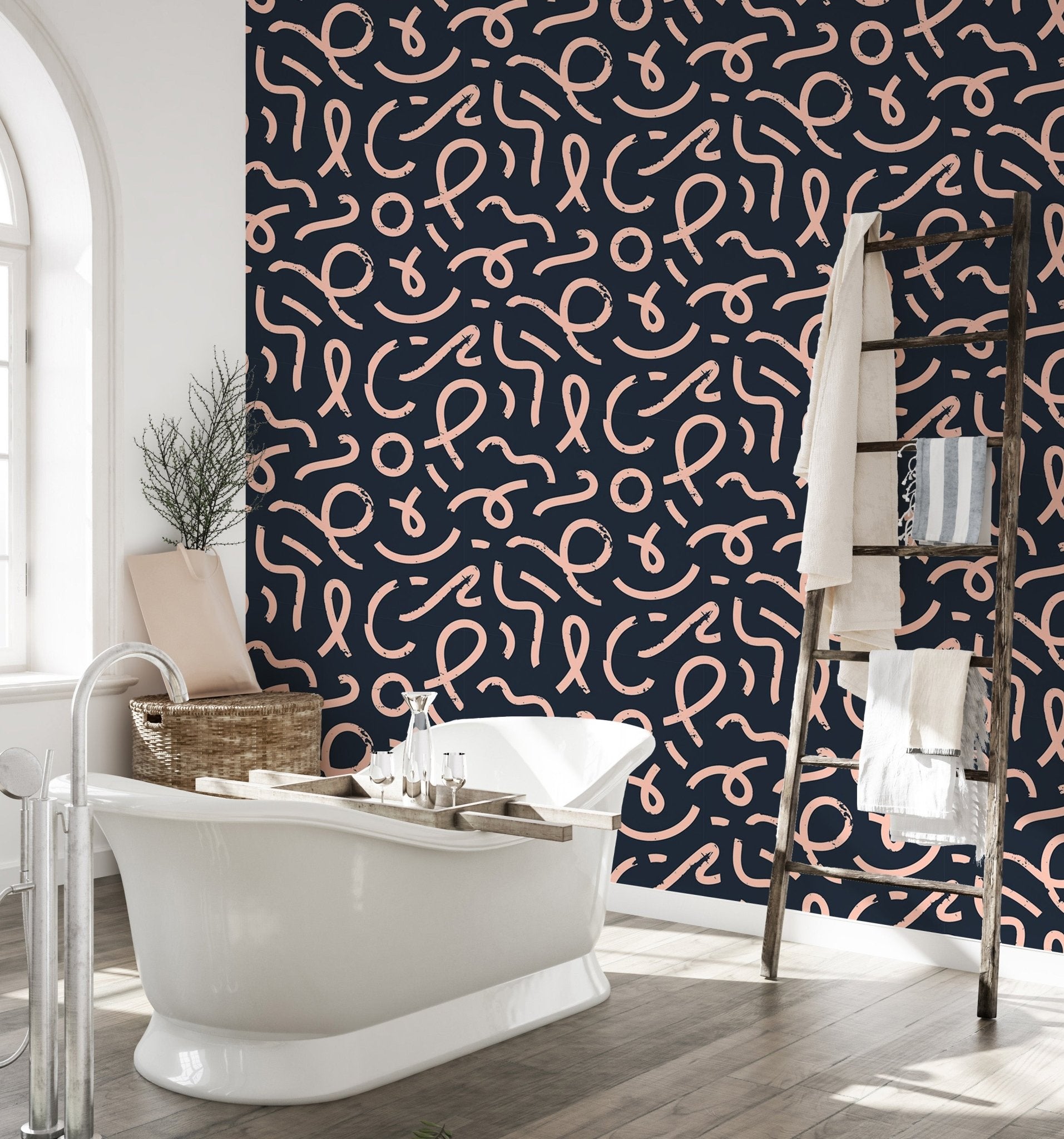 Dark navy wallpaper with pink line art in a modern bathroom with a white tub.