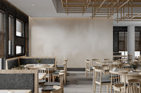 Subtle watercolor wall mural in beige tones for modern cafe area.
