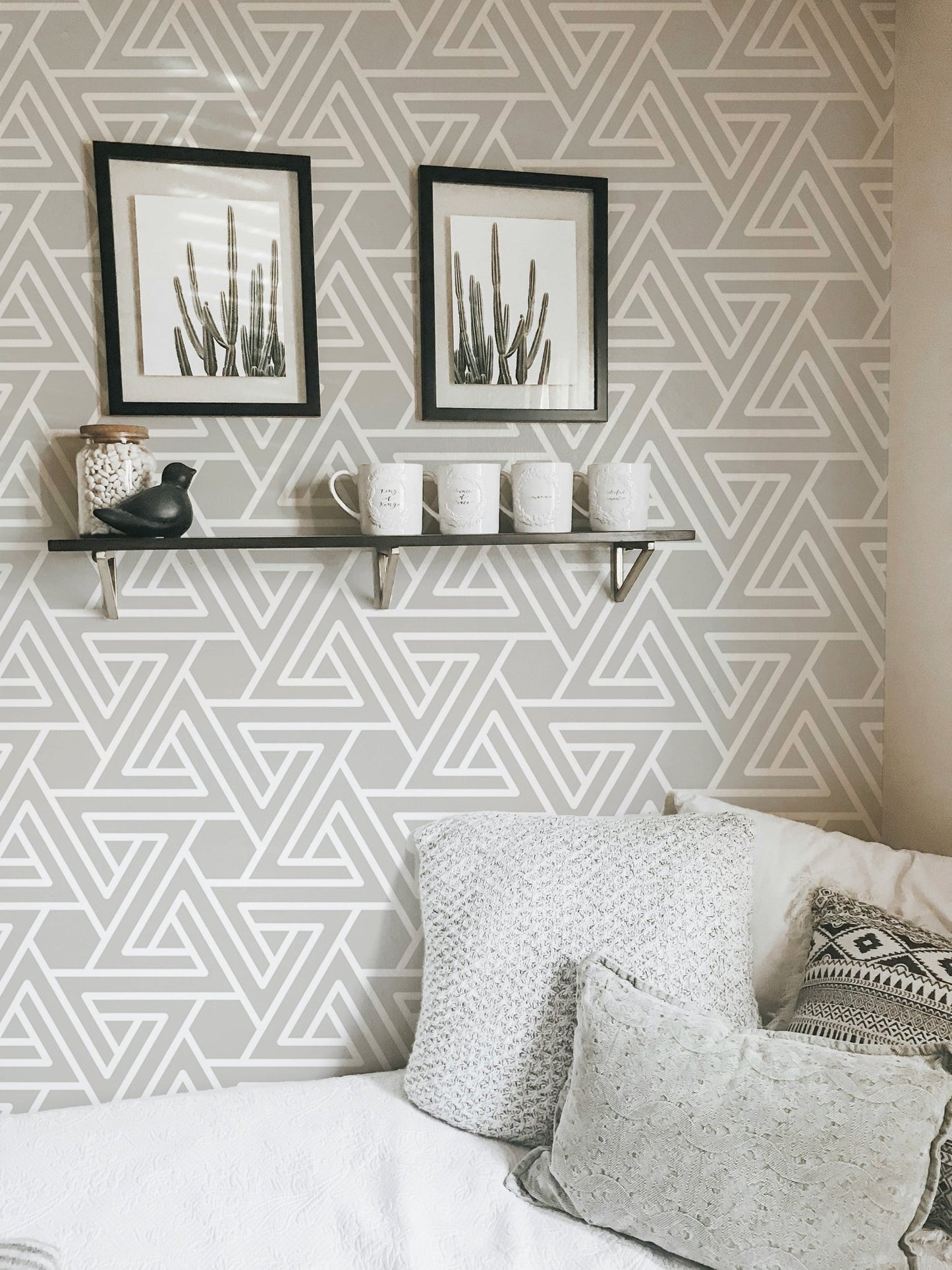 White line pattern wallpaper in a workspace with a floating shelf.