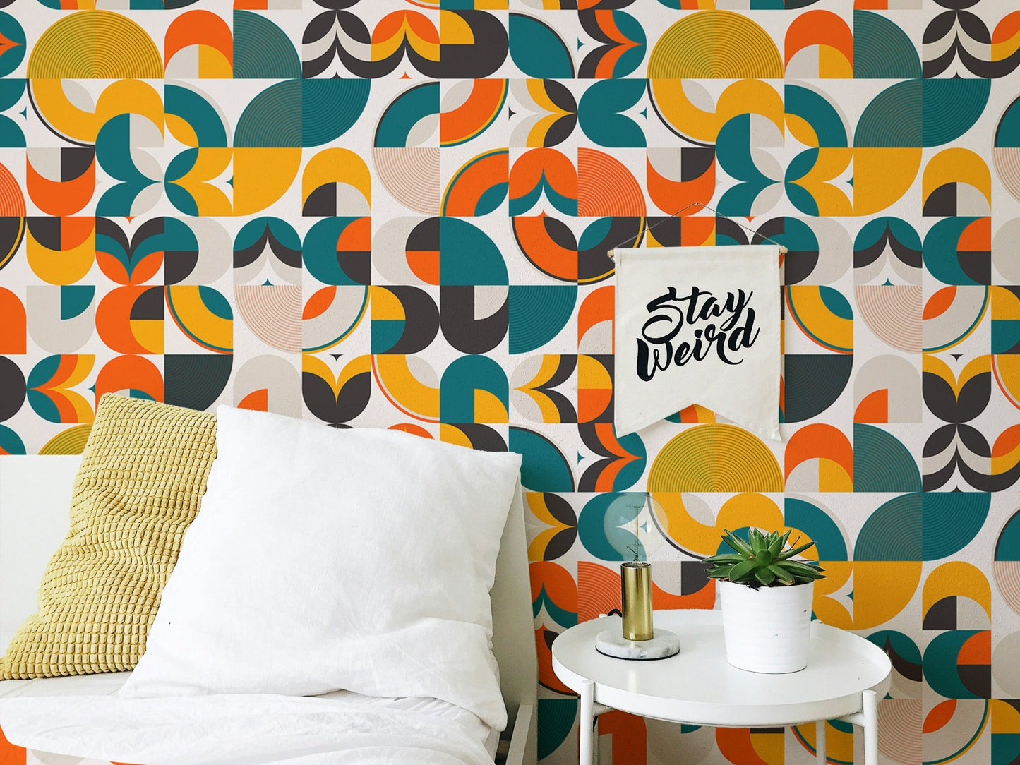 Abstract vector geometric shapes wallpaper in a bright bedroom with side table.