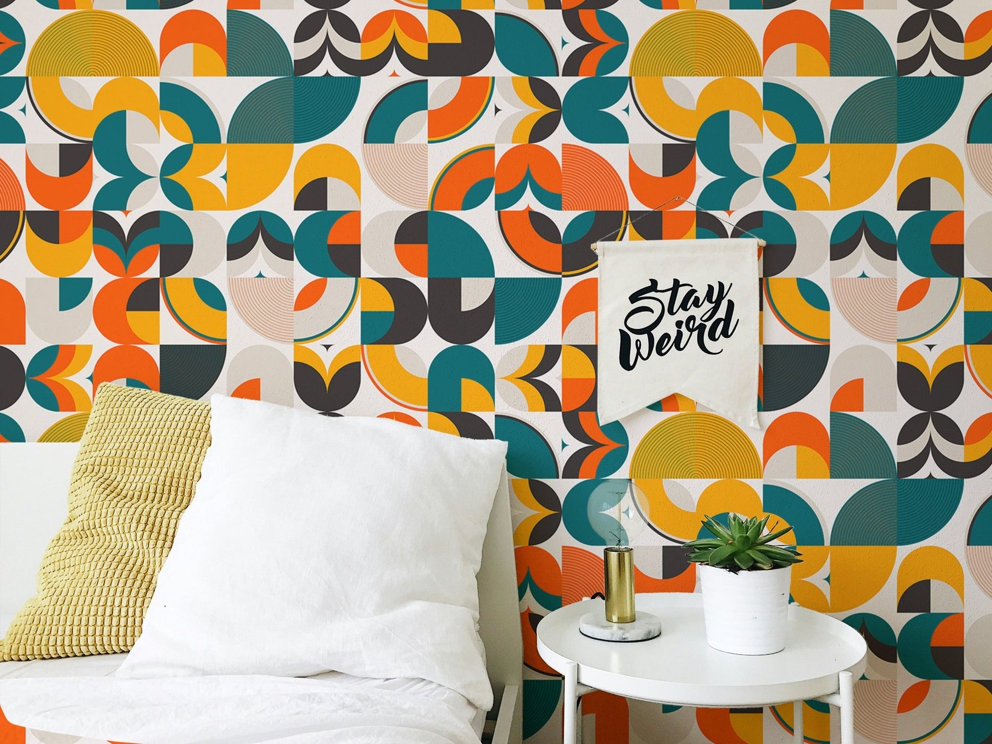 Abstract vector geometric shapes wallpaper in a bright bedroom with side table.