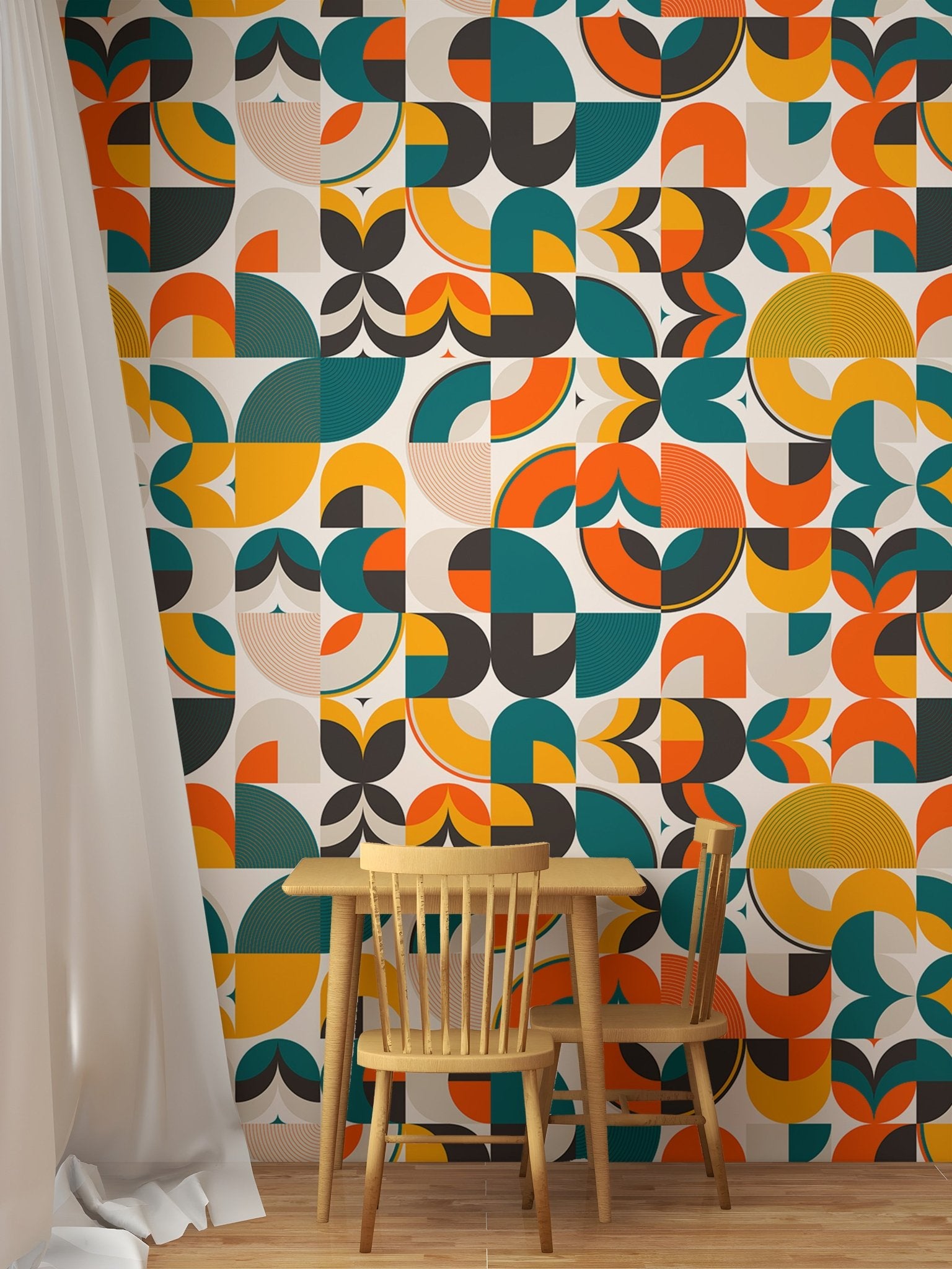 Geometric shapes wallpaper in a study nook with wooden chair and white curtains.