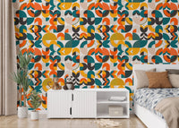 Scandi art wallpaper behind a white console and indoor green plant.