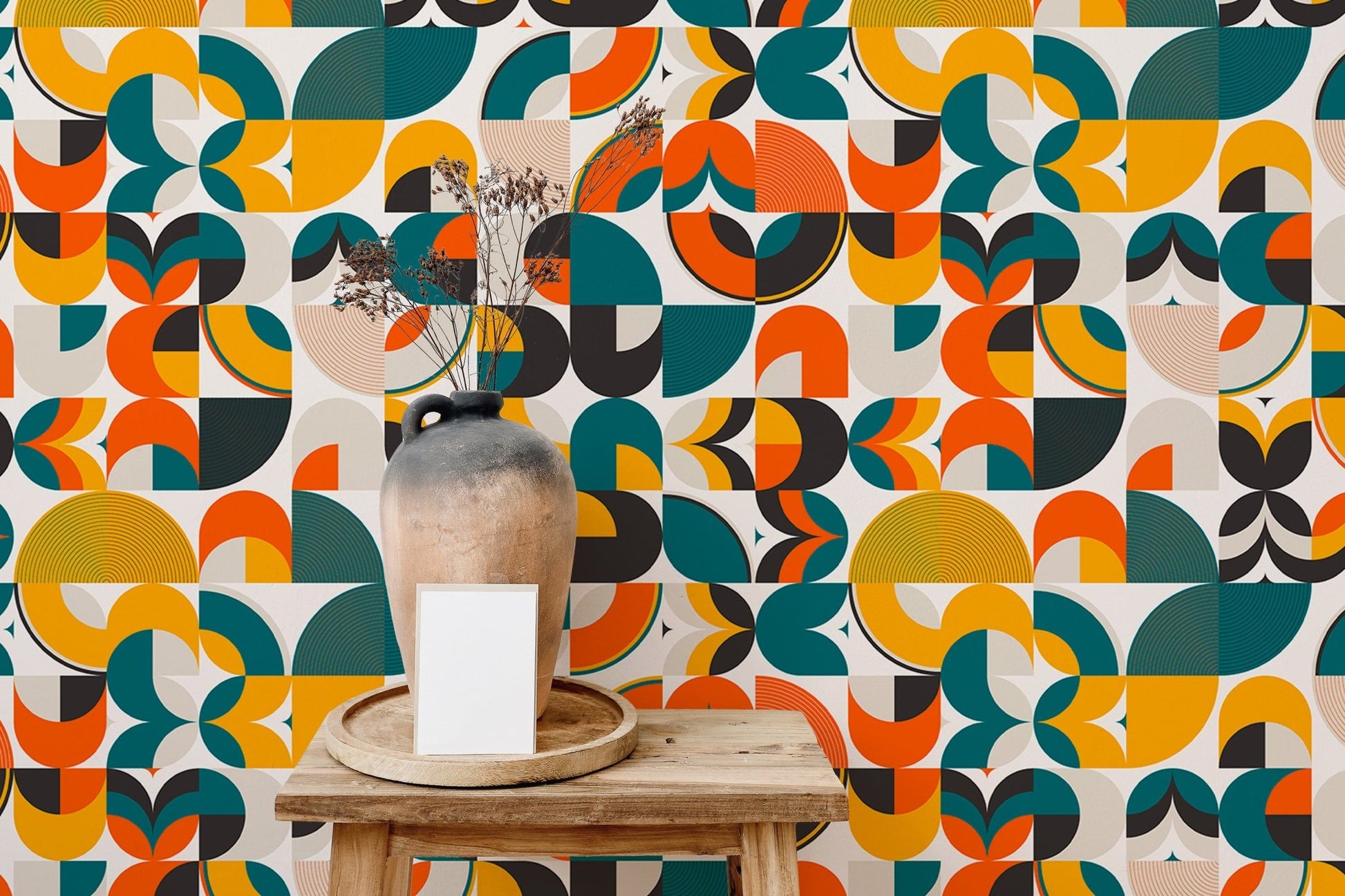 Mid-century vector pattern wallpaper featuring orange, green, and yellow shapes.